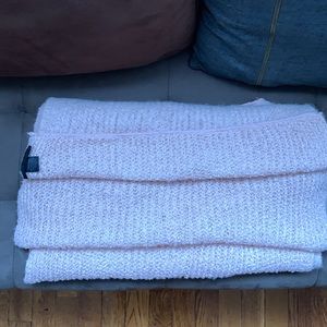 It’s a beautiful soft scarf made out of polyester